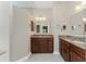 Bathroom featuring granite countertops and wood cabinets at 1069 Harbour Cape Pl, Punta Gorda, FL 33983