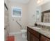 Neutral colored bathroom featuring granite countertops and handicap-accessible grab bars at 1069 Harbour Cape Pl, Punta Gorda, FL 33983