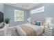 Bright bedroom featuring a neutral color scheme, ceiling fan, and ample natural light at 1069 Harbour Cape Pl, Punta Gorda, FL 33983