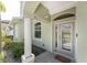 Close-up of a home's front door, showcasing its elegant design, sidelights, and welcoming entrance at 1069 Harbour Cape Pl, Punta Gorda, FL 33983