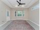 Living room featuring large windows with shutters and a decorative rug at 1069 Harbour Cape Pl, Punta Gorda, FL 33983