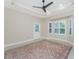 Living room featuring large windows with shutters and a decorative rug at 1069 Harbour Cape Pl, Punta Gorda, FL 33983