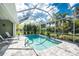 Inviting screened-in pool with landscaped patio area at 1069 Harbour Cape Pl, Punta Gorda, FL 33983