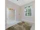 Bright room with tile flooring, neutral walls and view into the hallway at 1069 Harbour Cape Pl, Punta Gorda, FL 33983