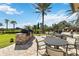 Outdoor kitchen with BBQ grills and seating at 11101 Sandhill Preserve Dr, Sarasota, FL 34238