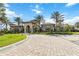 Impressive community center with grand entrance and manicured landscaping at 11101 Sandhill Preserve Dr, Sarasota, FL 34238