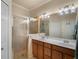 Double vanity bathroom with large shower and modern fixtures at 114 Babbling Brook Run, Bradenton, FL 34212