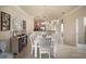 Open concept dining area with white table and chairs, near kitchen at 114 Babbling Brook Run, Bradenton, FL 34212