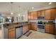 Updated kitchen featuring stainless steel appliances and granite countertops at 114 Babbling Brook Run, Bradenton, FL 34212