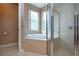 Bathroom featuring a large soaking tub and walk-in shower at 11458 Saffron Ct, Venice, FL 34292