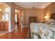 Main bedroom with ensuite bathroom access and wood floors at 11458 Saffron Ct, Venice, FL 34292