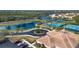 Aerial view of community with tennis courts, pool, and clubhouse at 11458 Saffron Ct, Venice, FL 34292