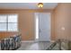 Bright and airy entryway with a comfy chair and neutral colors at 11458 Saffron Ct, Venice, FL 34292