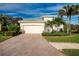 Attractive one-story house with a large driveway and well-maintained landscaping at 11458 Saffron Ct, Venice, FL 34292