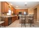 Well-equipped kitchen featuring ample cabinetry and a breakfast bar at 11458 Saffron Ct, Venice, FL 34292