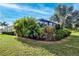 Expansive backyard with mature tropical landscaping at 11458 Saffron Ct, Venice, FL 34292