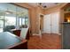 Home office with wood floors and access to patio at 11458 Saffron Ct, Venice, FL 34292