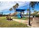 Community playground near pool and benches at 11458 Saffron Ct, Venice, FL 34292