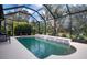 Enclosed pool area with a waterfall feature at 11458 Saffron Ct, Venice, FL 34292