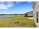 House with a backyard and lake view at 12977 Twin Bridges Dr, Riverview, FL 33579