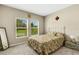 Charming bedroom with floral bedding and plenty of natural light at 12977 Twin Bridges Dr, Riverview, FL 33579