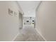 Bright and spacious hallway with carpeted flooring and neutral walls at 12977 Twin Bridges Dr, Riverview, FL 33579