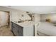 Kitchen island with white quartz countertops and gray cabinets at 12977 Twin Bridges Dr, Riverview, FL 33579