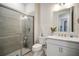 Bathroom with a walk-in shower, toilet, and vanity with a quartz countertop at 13299 Rinella St, Venice, FL 34293