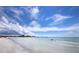 Stunning beach view with clear water and blue sky at 1336 Benjamin Franklin Dr # 1F, Sarasota, FL 34236