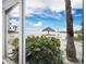 Beach view from window; lush vegetation at 1336 Benjamin Franklin Dr # 1F, Sarasota, FL 34236