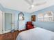 Relaxing bedroom with light walls, comfortable bed, and ocean views at 1336 Benjamin Franklin Dr # 1F, Sarasota, FL 34236