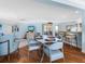 Bright dining area with table and chairs; kitchen view at 1336 Benjamin Franklin Dr # 1F, Sarasota, FL 34236