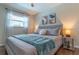 Spacious bedroom with king-size bed, window, and tasteful decor at 134 Rotonda Cir, Rotonda West, FL 33947