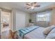 Bright bedroom with a queen-size bed and access to another room at 134 Rotonda Cir, Rotonda West, FL 33947