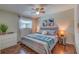 Spacious bedroom with a king-size bed and wood floors at 134 Rotonda Cir, Rotonda West, FL 33947