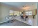 Bright dining room with wood table, chairs, and view to backyard at 134 Rotonda Cir, Rotonda West, FL 33947