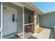 Front entry with screened porch and decorative pot at 134 Rotonda Cir, Rotonda West, FL 33947