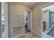 Clean hallway with tile floors and access to bedrooms and bathroom at 134 Rotonda Cir, Rotonda West, FL 33947