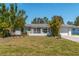 Front view of a single-story home with landscaping at 134 Rotonda Cir, Rotonda West, FL 33947