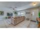 Bright living room with sectional sofa and tile floors at 134 Rotonda Cir, Rotonda West, FL 33947