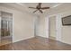 Bedroom with vinyl floors with attached bathroom featuring a walk in shower at 14208 Woodhall Pl, Bradenton, FL 34202