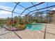 This home features a private screened pool surrounded by tropical landscaping at 14208 Woodhall Pl, Bradenton, FL 34202