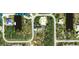 Aerial view of a single-Gathering home on a residential lot at 15079 Wichita Rd, Port Charlotte, FL 33981