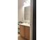 Clean bathroom with light wood vanity and a large mirror at 15079 Wichita Rd, Port Charlotte, FL 33981