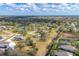 Neighborhood aerial view shows large lots, mature trees and a nearby waterway at 1573 Shadow Ridge Cir, Sarasota, FL 34240