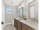 Modern bathroom with dual sinks, marble countertops, and stylish fixtures at 1573 Shadow Ridge Cir, Sarasota, FL 34240