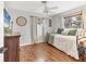 Guest bedroom with daybed, wood floors, and soft, natural light at 1573 Shadow Ridge Cir, Sarasota, FL 34240