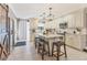 This beautifully updated kitchen features marble countertops, island with seating, and stainless appliances at 1573 Shadow Ridge Cir, Sarasota, FL 34240