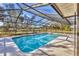 Enclosed pool with plenty of natural light and blue, refreshing water at 1573 Shadow Ridge Cir, Sarasota, FL 34240