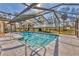 An inviting pool with crystal-clear water and convenient access steps at 1573 Shadow Ridge Cir, Sarasota, FL 34240